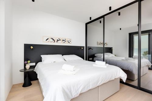 מיטה או מיטות בחדר ב-Villa Atrio