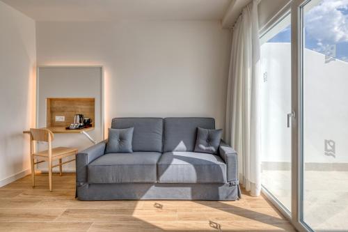 a living room with a couch and a table at Playamojácar in Mojácar