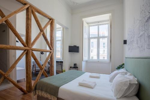 Ein Bett oder Betten in einem Zimmer der Unterkunft Lisbon Check-In Guesthouse