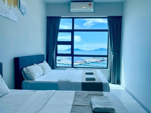 Ένα ή περισσότερα κρεβάτια σε δωμάτιο στο Sunset Seaview Vacation Condos @ Jesselton Quay