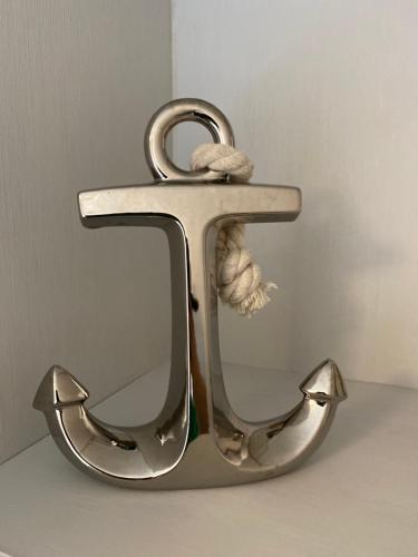 a metal letter h with a stuffed animal in a mirror at Edinburgh, Seton Sands Abi Horizon in Edinburgh