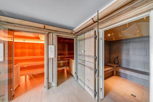a sauna with wooden walls and wooden flooring at Hotel Landgasthof Eischen in Appenzell