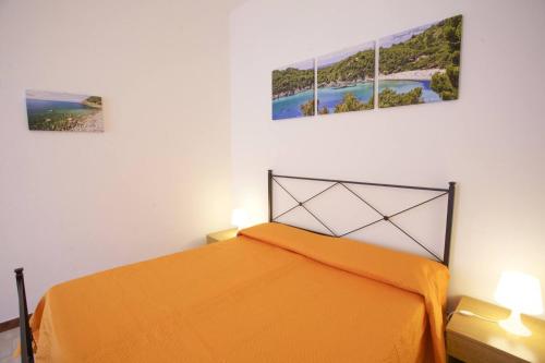 En eller flere senge i et værelse på Villa Conti Residence