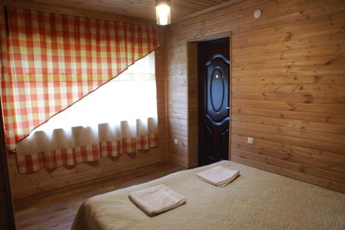A bed or beds in a room at Cottage Woodside