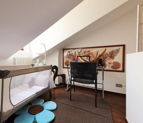 a bedroom with a bunk bed and a desk at Bellagio Retreat lake view apartment in Limonta