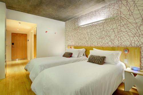 Ένα ή περισσότερα κρεβάτια σε δωμάτιο στο Pleno Palermo Soho