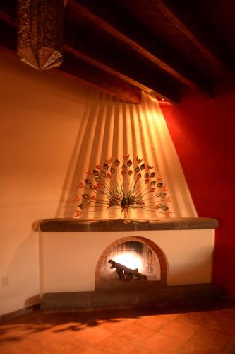 a brick fireplace with a light coming out of it at Hotel Chocolate Suites in Guanajuato
