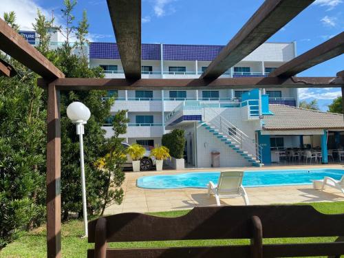 a view of a building with a swimming pool at Hotel Adventure São Luís in São Luís