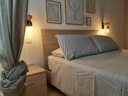 A bed or beds in a room at Sotto il Portico Home