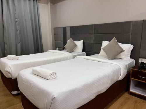 Ένα ή περισσότερα κρεβάτια σε δωμάτιο στο The Phoenix Residency