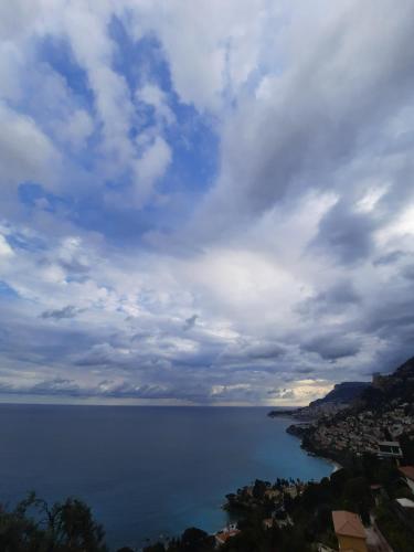a view of a large body of water under a cloudy sky at Soutariba in Roquebrune-Cap-Martin