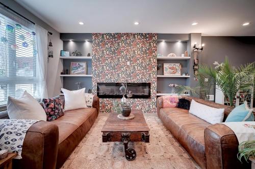 a living room with a couch and a fireplace at Artsy Hidden Gem ll -Free Parking -- in Philadelphia
