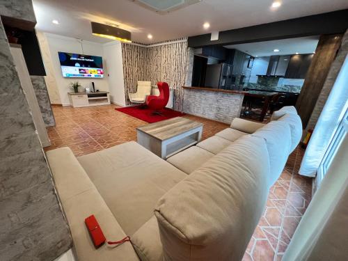 a living room with a couch and a table at Oviedo Real Spa in Oviedo