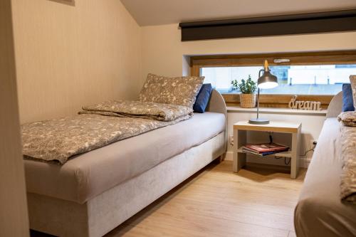 Postel nebo postele na pokoji v ubytování Apartamenty z tarasami - Moja Gdynia