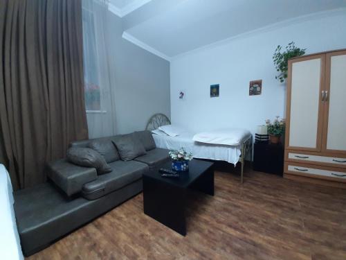 a living room with a couch and a table at kessane in Akhaltsikhe