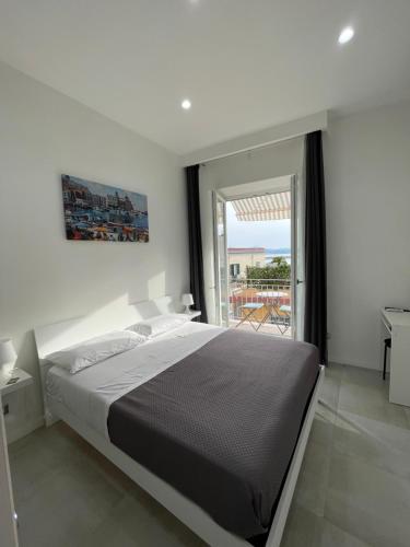 Ένα ή περισσότερα κρεβάτια σε δωμάτιο στο Terrazza Don Mario bed&breakfast