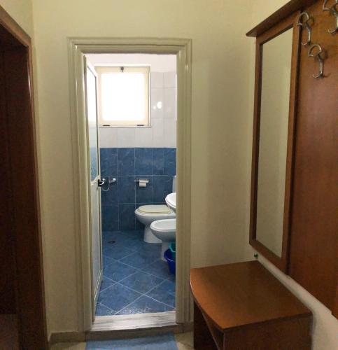 a bathroom with a toilet and a sink at Relax Apartment & Hotel in Golem