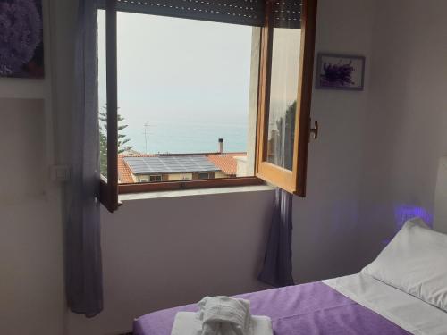Ένα ή περισσότερα κρεβάτια σε δωμάτιο στο Eolie House