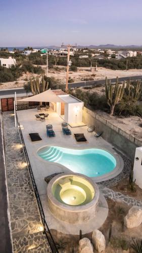 a large swimming pool in the middle of a desert at Baja and Kite in La Ventana