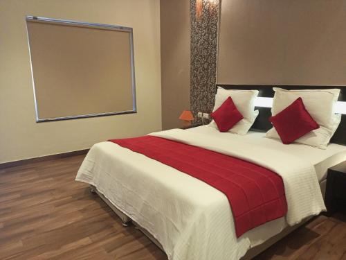 Ένα ή περισσότερα κρεβάτια σε δωμάτιο στο Mount Retreat Resorts - Madurai