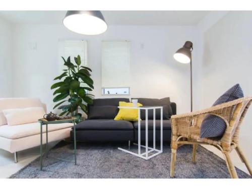 a living room with a couch and a table at Hotel chen's house - Vacation STAY 42508v in Tokyo