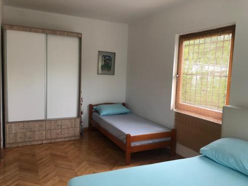 Ένα ή περισσότερα κρεβάτια σε δωμάτιο στο Holiday Home Iris