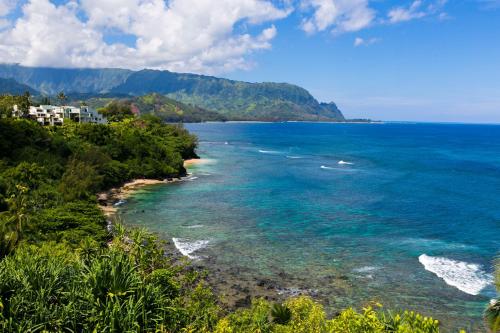 a view of the ocean from a hill at Pali Ke Kua 116 in Princeville