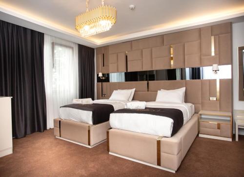 Ένα ή περισσότερα κρεβάτια σε δωμάτιο στο Pelit Park Hotel