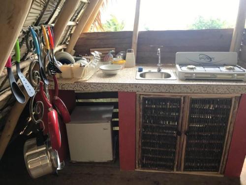 a kitchen with a counter and a sink in an rv at Sea view Casita Eco Casa Algana in Caña Félix