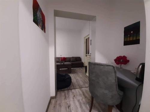 a living room with a chair and a couch at kessane in Akhaltsikhe