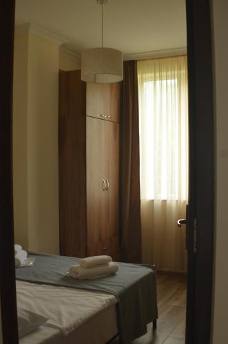 Postel nebo postele na pokoji v ubytování Gonio - Stumari Apartaments