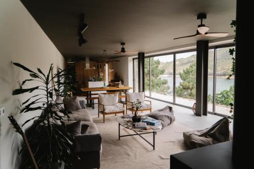 a living room with a couch and a table at Zab Living in Vila de Rei