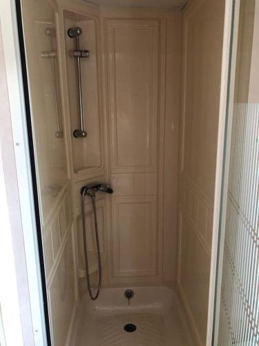 a shower in a bathroom with a shower at Siódme Niebo na Cuplu in Serock