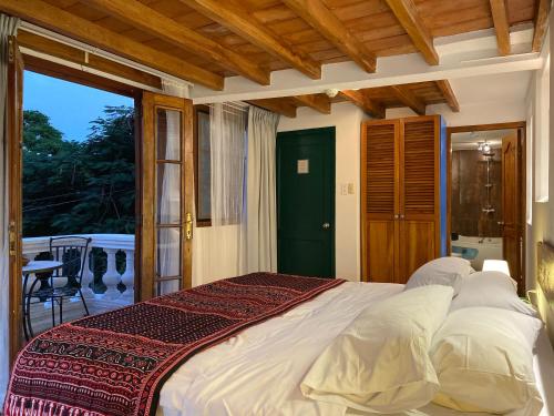Postel nebo postele na pokoji v ubytování Iguanazu Bed & Breakfast