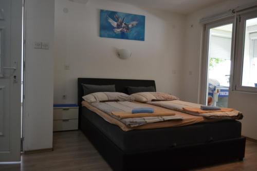 Una cama o camas en una habitación de Rzav Višegrad centar