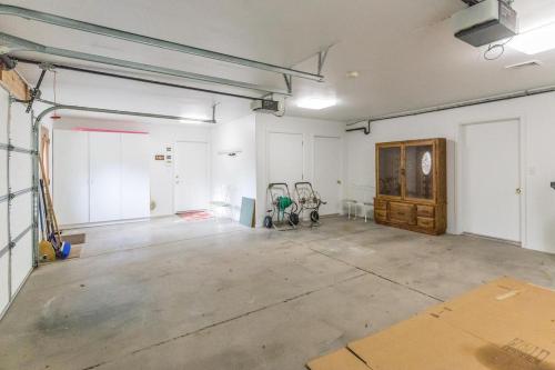 an empty garage with white walls and a room at 177 Blue Tip Drive in Ridgway