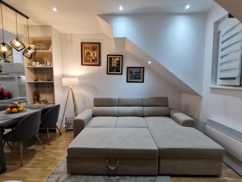 a living room with a couch and a table at Silver Star Zlatibor in Zlatibor