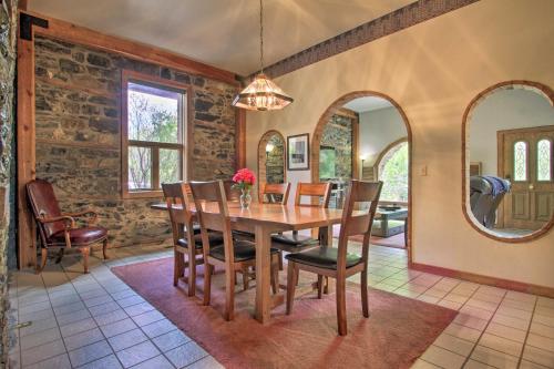 a dining room with a table and chairs and mirrors at Historic Helena Retreat - Near Dtwn and Mt Helena! in Helena