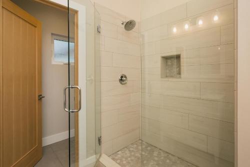 a bathroom with a shower with a glass door at 7043 County Road 203 - Durango Valley View in Hermosa
