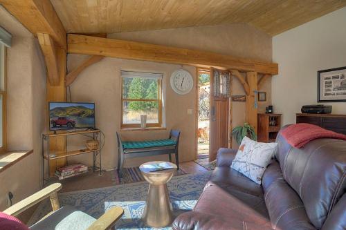 a living room with a couch and a table at Pine Meadow Cabin 160 Sierra Circle in Vallecito