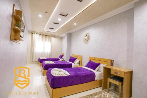Una cama o camas en una habitación de HOTEL BEAUPORT