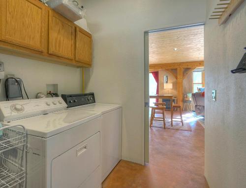 a kitchen with a dishwasher and a dining room at Pine Meadow Cabin 160 Sierra Circle in Vallecito