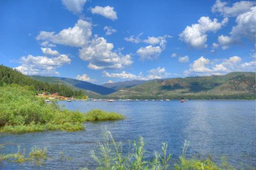 a view of a river with mountains in the background at Waterfront Cabin on Vallecito Lake in Vallecito