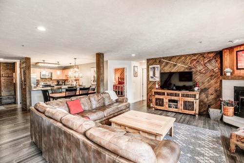 a living room with a couch and a table at Cimarron Bear Condo: Fantastic Location, Sleeps 8 in Breckenridge