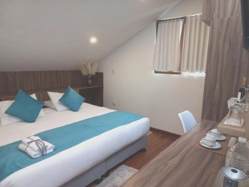 Postel nebo postele na pokoji v ubytování Katari Apart Hotel at Qorikancha