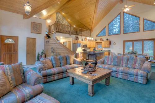 a large living room with couches and a table at Vallecito Family Retreat in Bayfield