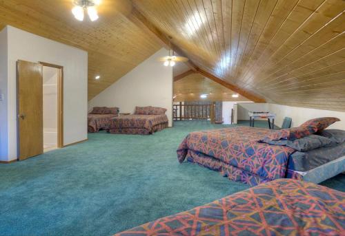 a large room with two beds and a couch at Vallecito Family Retreat in Bayfield