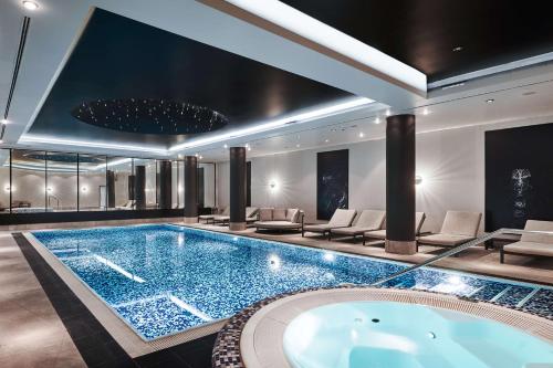 a large swimming pool in a hotel room at Radisson Collection Hotel, Warsaw in Warsaw