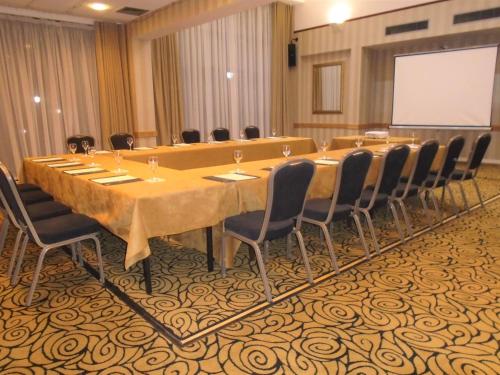 a large conference room with a long table and chairs at Pitbauchlie House Hotel - Sure Hotel Collection by Best Western in Dunfermline