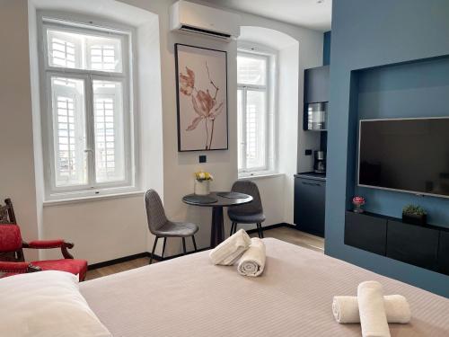 Posteľ alebo postele v izbe v ubytovaní Navis city apartments